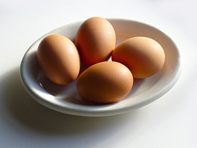 A picture of eggs on a saucer.